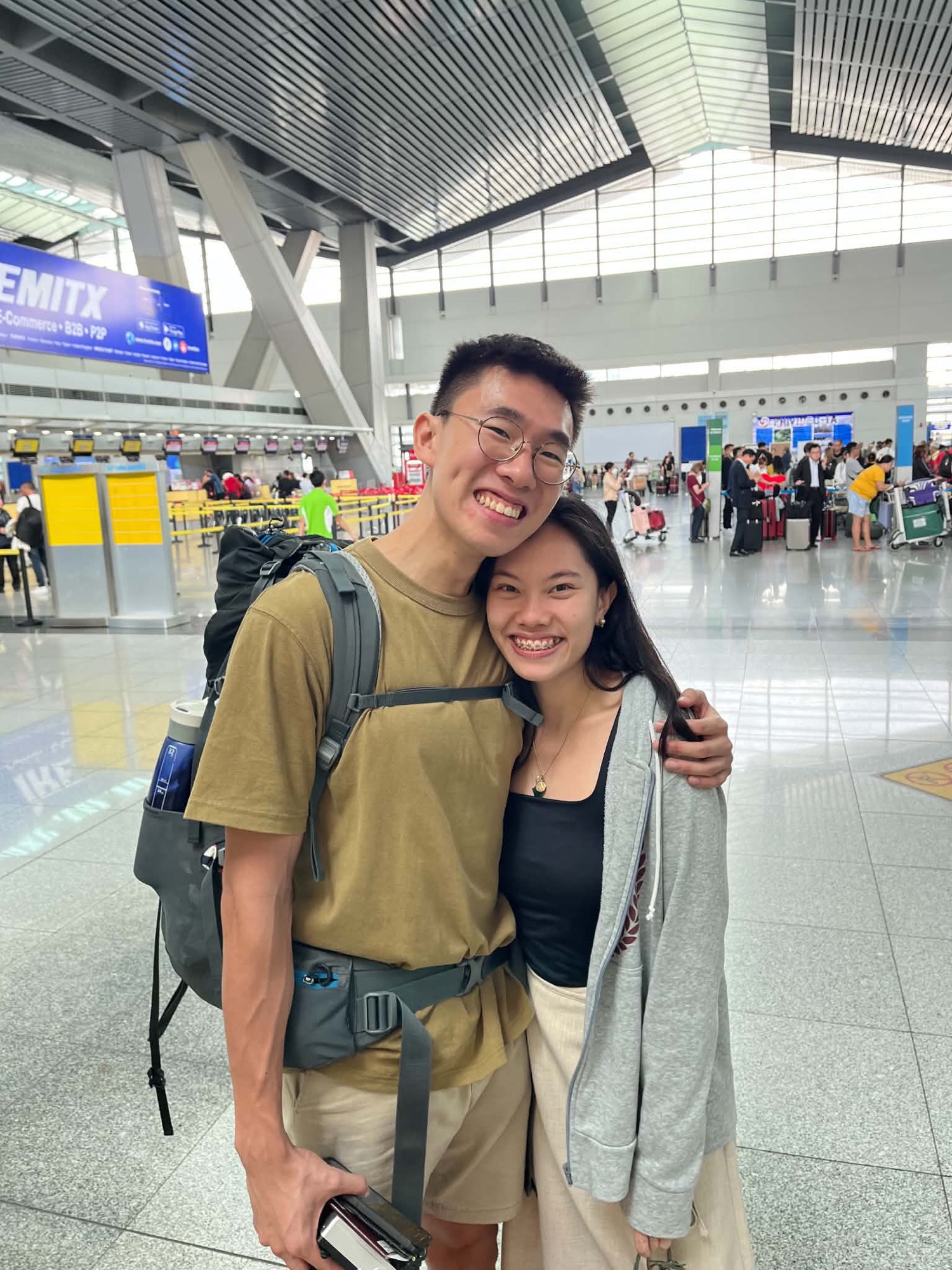 Atom and Joanne saying goodbye at the airport